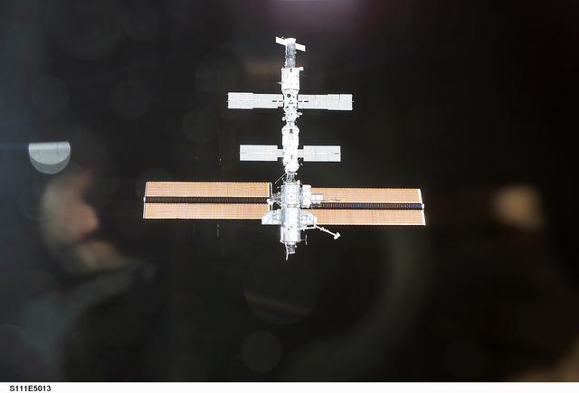 View of the ISS against the blackness of space as photographed by an STS-111 UF-2 crewmember
