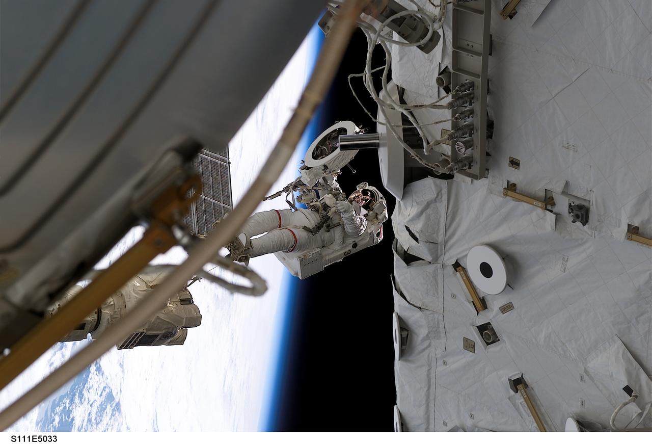 STS111-E-5033 (8 June 2002) --- Astronaut Franklin R. Chang-Diaz works with a grapple fixture during  extravehicular activity (EVA) to perform work on the International Space Station (ISS).  The first spacewalk of the STS-111 mission  began with the installation of a Power and Data Grapple Fixture (PDGF) for the station's robotic arm on the complex's P6 truss. The PDGF will allow the robotic arm to grip the P6 truss for future station assembly operations. Astronauts Chang-Diaz and Philippe Perrin (with French Space Agency, CNES)went on to install the new fixture about halfway  up the P6 truss, the vertical structure that currently supports the station's set of large U.S. solar arrays.