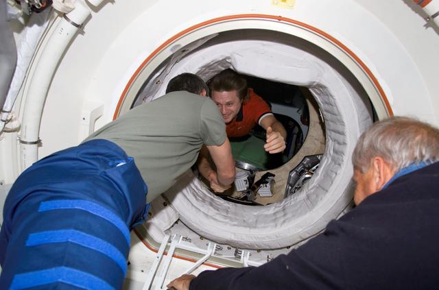 Onufrienko greets Korzun in PMA 2 during STS-111 UF-2 ingress to the ISS