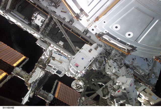 NASA image: Chang-Diaz and Perrin work at the MBS on the S0 (S-zero) truss during STS-111 UF-2 EVA 2