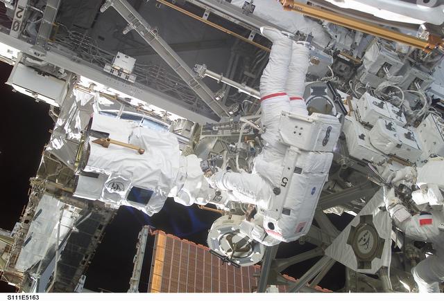 NASA image: Chang-Diaz and Perrin work at the MBS on the S0 (S-zero) truss during STS-111 UF-2 EVA 2