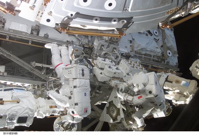 Chang-Diaz and Perrin work at the MBS on the S0 (S-zero) truss during STS-111 UF-2 EVA 2