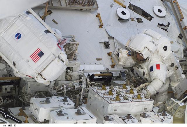 NASA image: Chang-Diaz and Perrin attach power and data cables to MBS during STS-111 UF-2 EVA 2