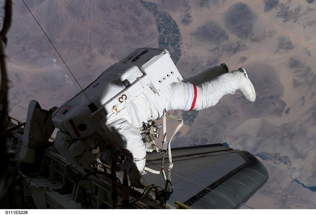 STS111-E-5226 (11 June 2002) --- Astronaut Franklin R. Chang-Diaz, STS-111 mission specialist, participates in the second scheduled session of extravehicular activity (EVA) for the STS-111 mission. During the 5-hour spacewalk, Chang-Diaz and Perrin completed installation of the Mobile Remote Servicer Base System (MBS) on the International Space Station’s (ISS) railcar, the Mobile Transporter.
