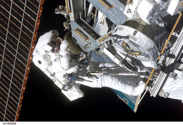NASA image: Perrin installs the MBS to the Mobile Transporter railcar during STS-111 UF-2 EVA 2