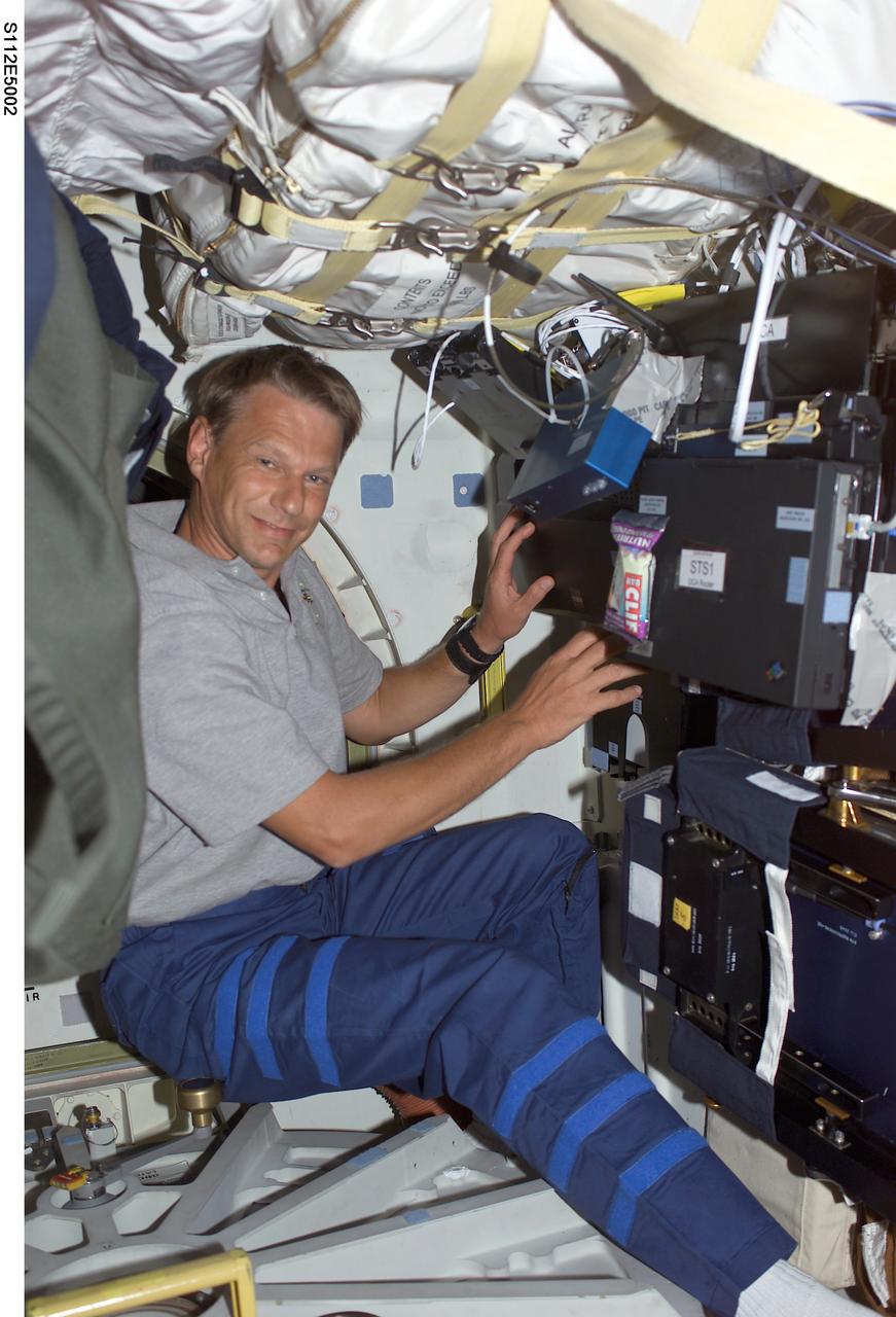 STS112-E-05002 (8 October 2002) --- Astronaut Piers J. Sellers, STS-112 mission specialist, is pictured on the middeck of the Space Shuttle Atlantis.