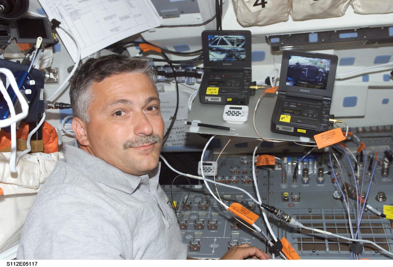 STS112-E-05117 (10 October 2002) --- Cosmonaut Fyodor N. Yurchikhin, STS-112 mission specialist, is pictured on the flight deck of the Space Shuttle Atlantis. Yurchikhin represents Rosaviakosmos.