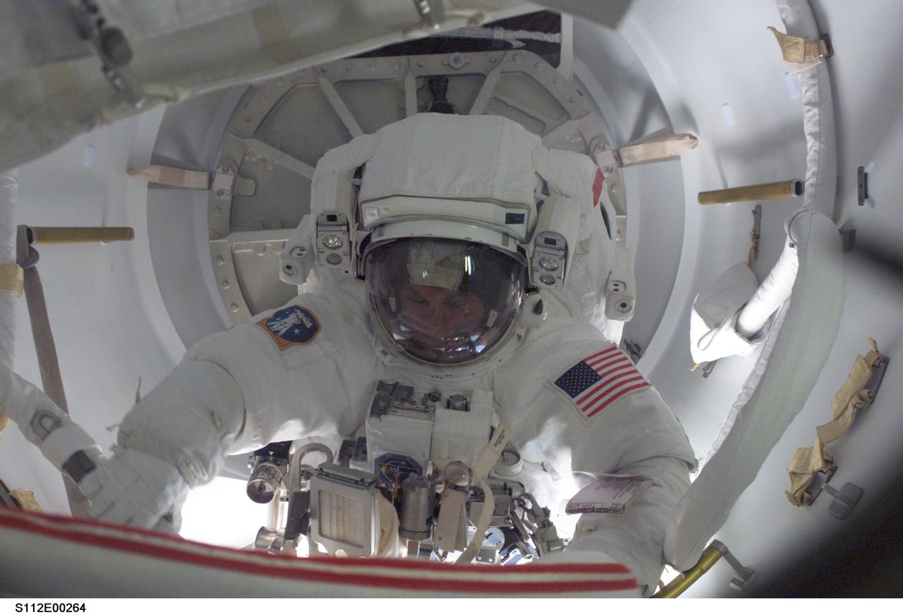 STS112-E-5264 (12 October 2002) --- Astronaut David A. Wolf, STS-112 mission specialist, is ready to egress  the airlock to begin the mission's second scheduled spacewalk.