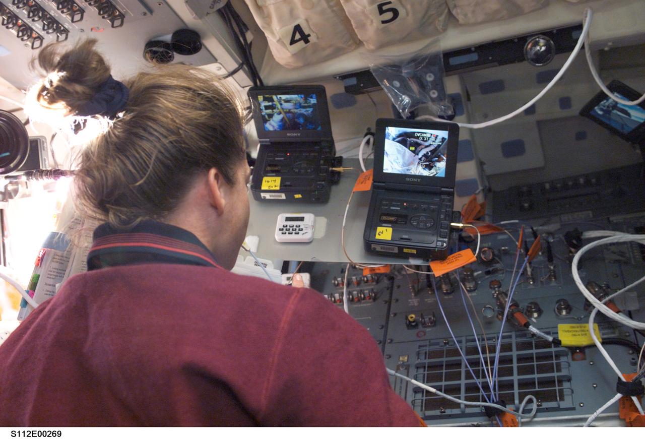 STS112-E-5269 (12 October 2002) --- Astronaut Pamela A. Melroy, STS-112 pilot, supports the mission's second spacewalk from the aft flight deck of the Space Shuttle Atlantis.
