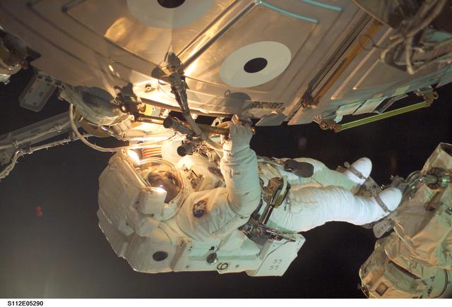 NASA image: MS Sellers connects cables during EVA 2