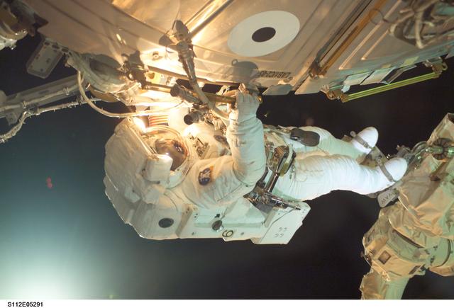 NASA image: MS Sellers connects cables during EVA 2