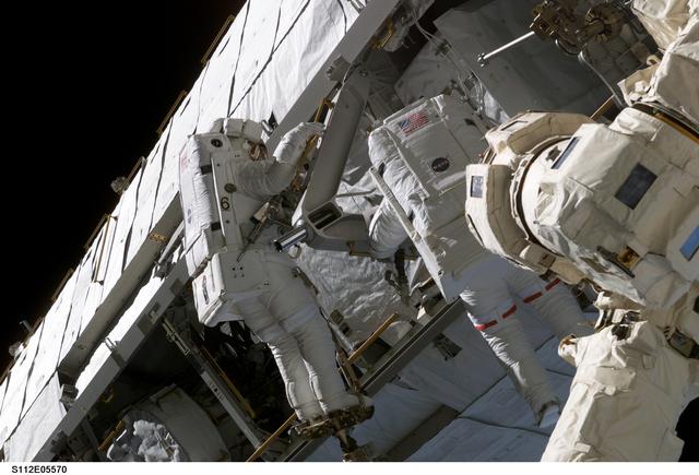 NASA image: MS Sellers and Wolf on S1 truss during EVA 3
