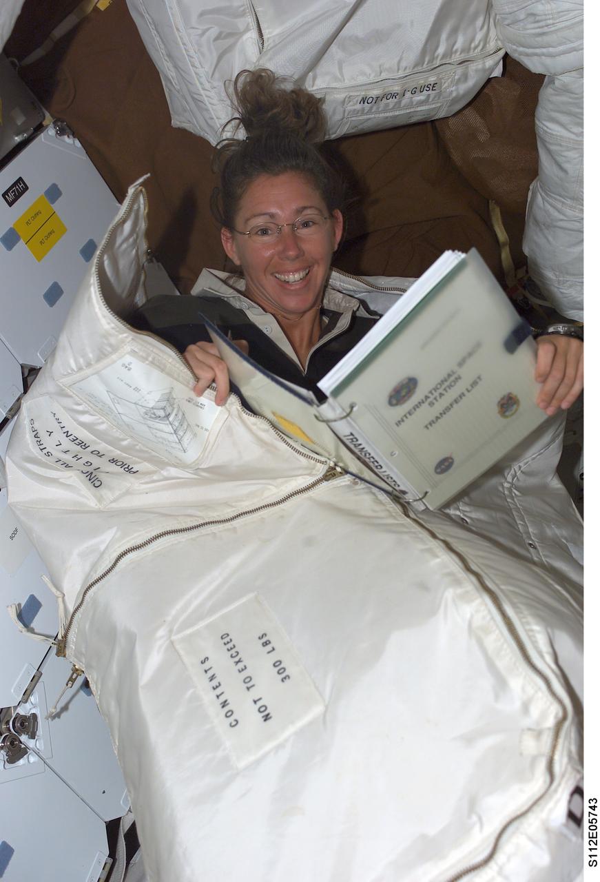 STS112-E-05743 (15 October 2002) --- Astronaut Sandra H. Magnus, STS-112 mission specialist, enjoys a light moment while participating in the ongoing effort to move supplies from the Space Shuttle Atlantis to the International Space Station (ISS).