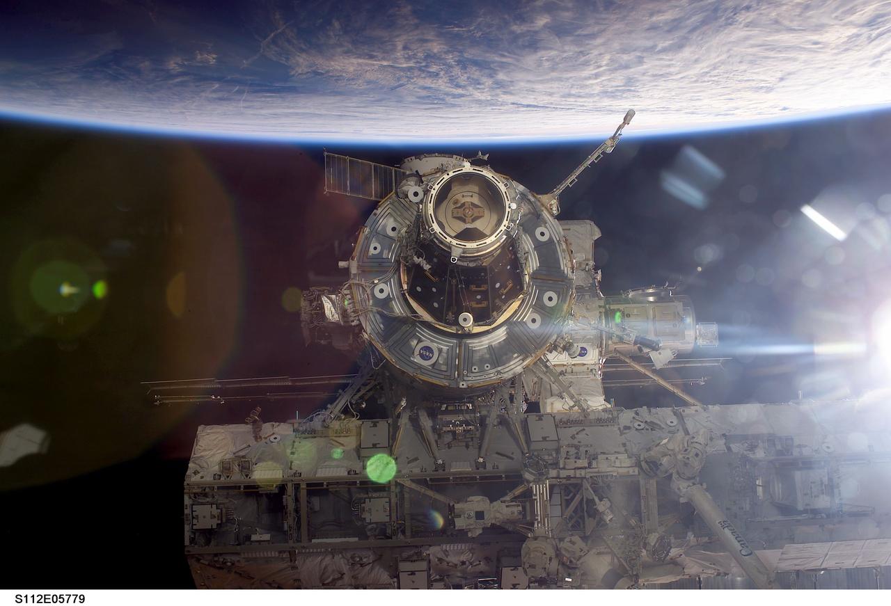 STS112-E-05779 (16 October 2002) --- Backdropped by the blackness of space and Earth&#0146;s horizon, this close-up view of the International Space Station (ISS) was photographed by a crewmember on board the Space Shuttle Atlantis following the undocking of the two spacecraft. Atlantis pulled away from the complex at 8:13 a.m. (CDT) on October 16, 2002. The S0 (S-Zero) Truss and a portion of the newly added Starboard One (S1) Truss are visible in lower frame.