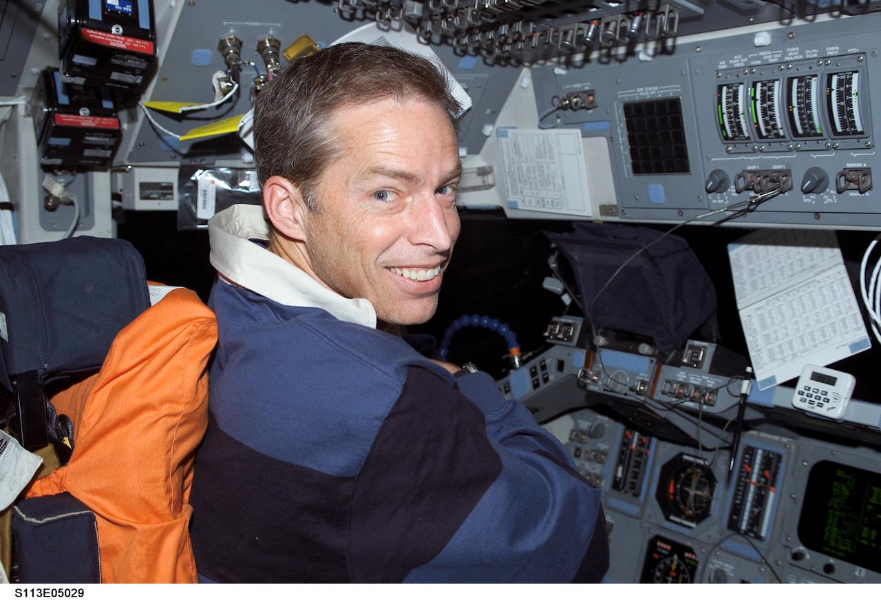 STS113-E-05029 (25 November 2002) --- Astronaut James D. Wetherbee, STS-113 mission commander, occupies the commander&#0146;s station on the forward flight deck of the Space Shuttle Endeavour during rendezvous operations with the International Space Station (ISS).