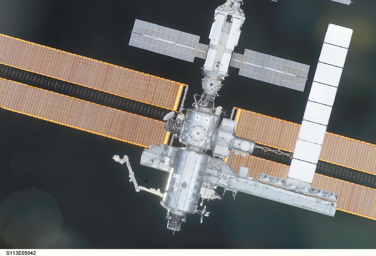 STS113-E-5042 (25 November 2002) --- The International Space Station (ISS) is backdropped against the blackness of space as the Space Shuttle Endeavour quickly approaches the orbital outpost for a November 25 docking. The shuttle went on to dock with the International Space Station at 3:59 p.m. (CST), bringing a new crew and another segment of the station's backbone, the Port One (P1) segment of the Integrated Truss System. The rendezvous and docking of Endeavour with astronaut James D. Wetherbee, mission commander, at the controls, occurred about 248 statute miles above the South Pacific off the southeastern coast of Australia.