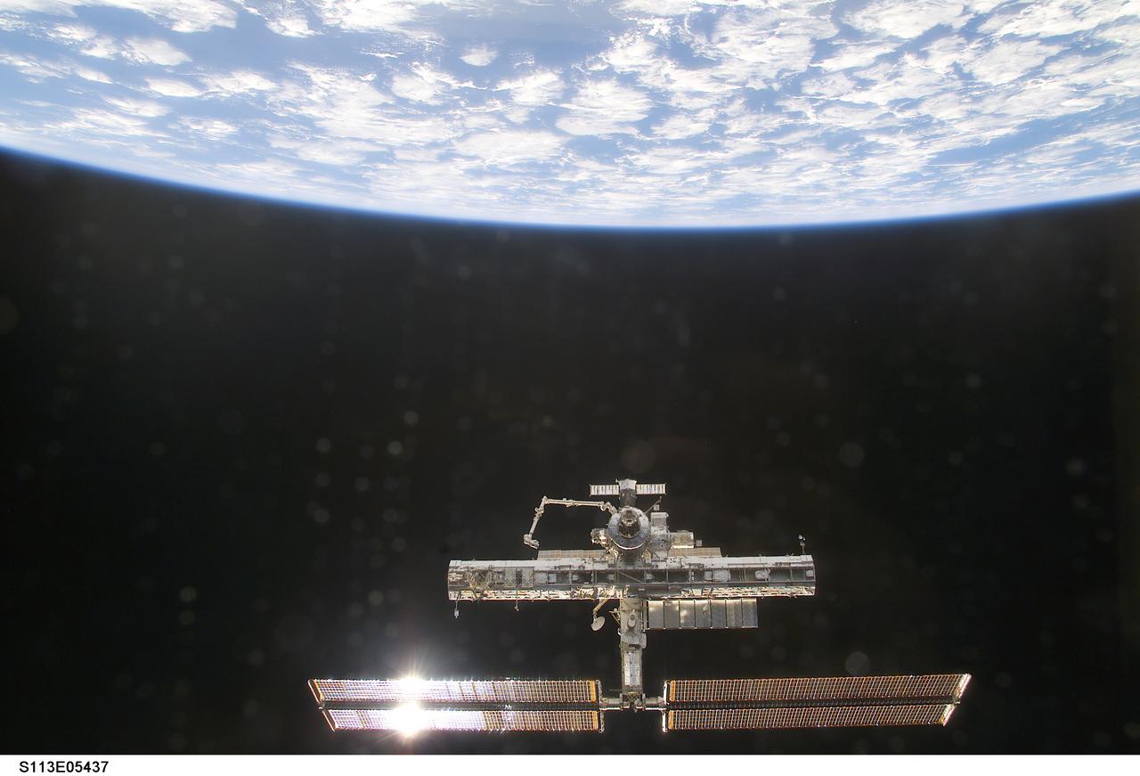 Overall exterior views of the ISS during Undocking and Flyaround Operations for STS-113 (11A)
