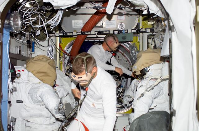 NASA image: Swanson and Forrester wear PBA in the A/L during Joint Operations