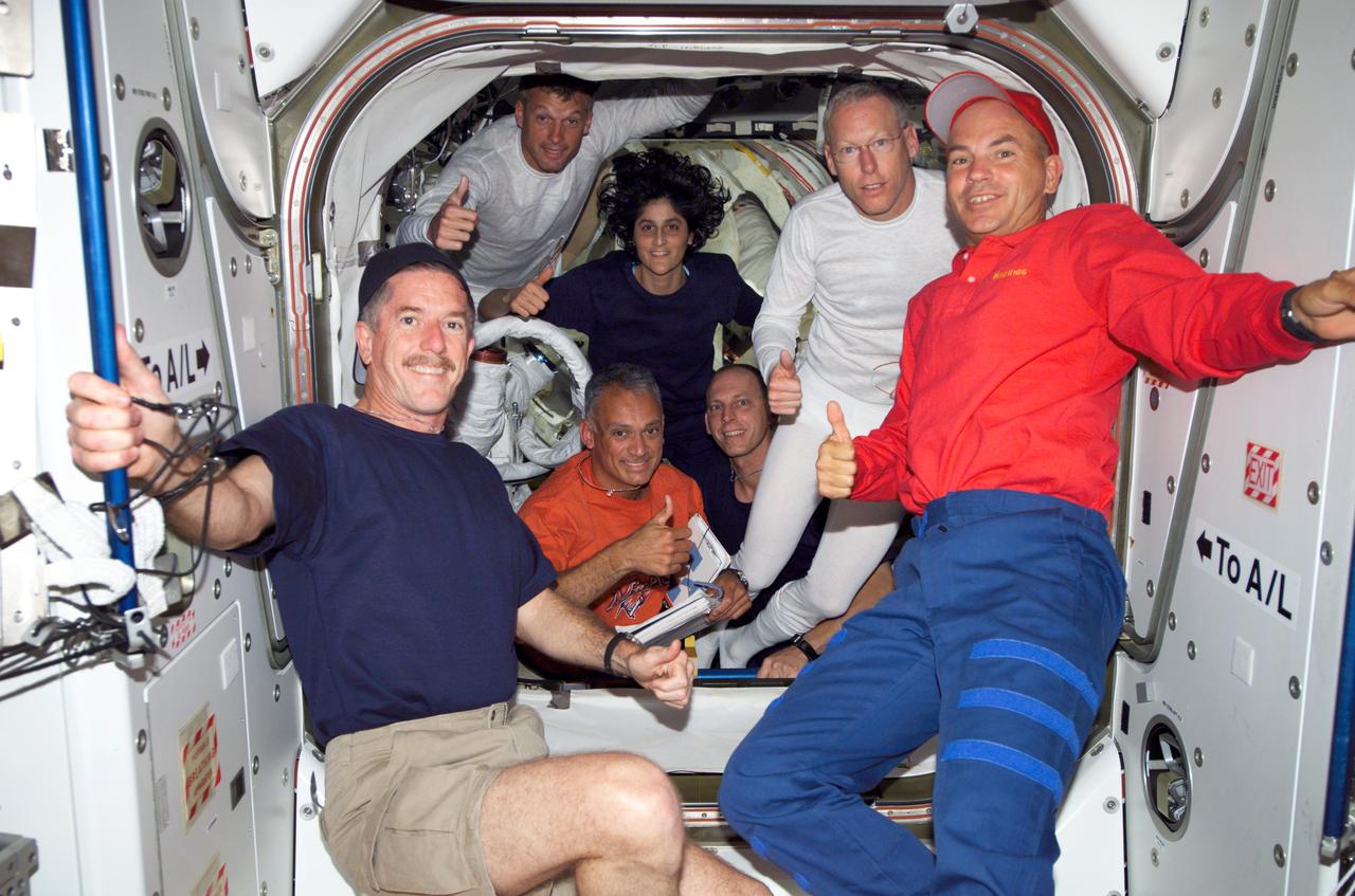 S117-E-07229 (13 June 2007) --- Crewmembers on the International Space Station give a "thumbs-up" signal following a successful session of extravehicular activity (EVA) while Space Shuttle Atlantis was docked with the station. Pictured (from the left, clockwise) are astronauts Jim Reilly, John "Danny" Olivas, Steven Swanson, Sunita Williams, all STS-117 mission specialists; Clayton Anderson, Expedition 15 flight engineer; Patrick Forrester, STS-117 mission specialist; and Rick Sturckow, STS-117 commander.