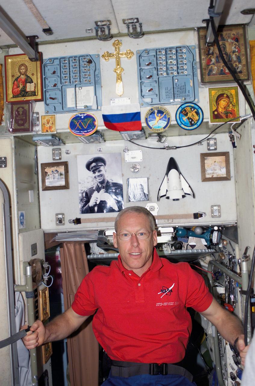 S117-E-09497 (17 June 2007) --- Astronaut Patrick Forrester, STS-117 mission specialist, poses for a photo in the Zvezda Service Module of the International Space Station while Space Shuttle Atlantis was docked with the station.