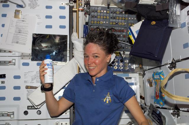NASA image: Nowak washes her hair during STS-121 / Expedition 13 joint operations