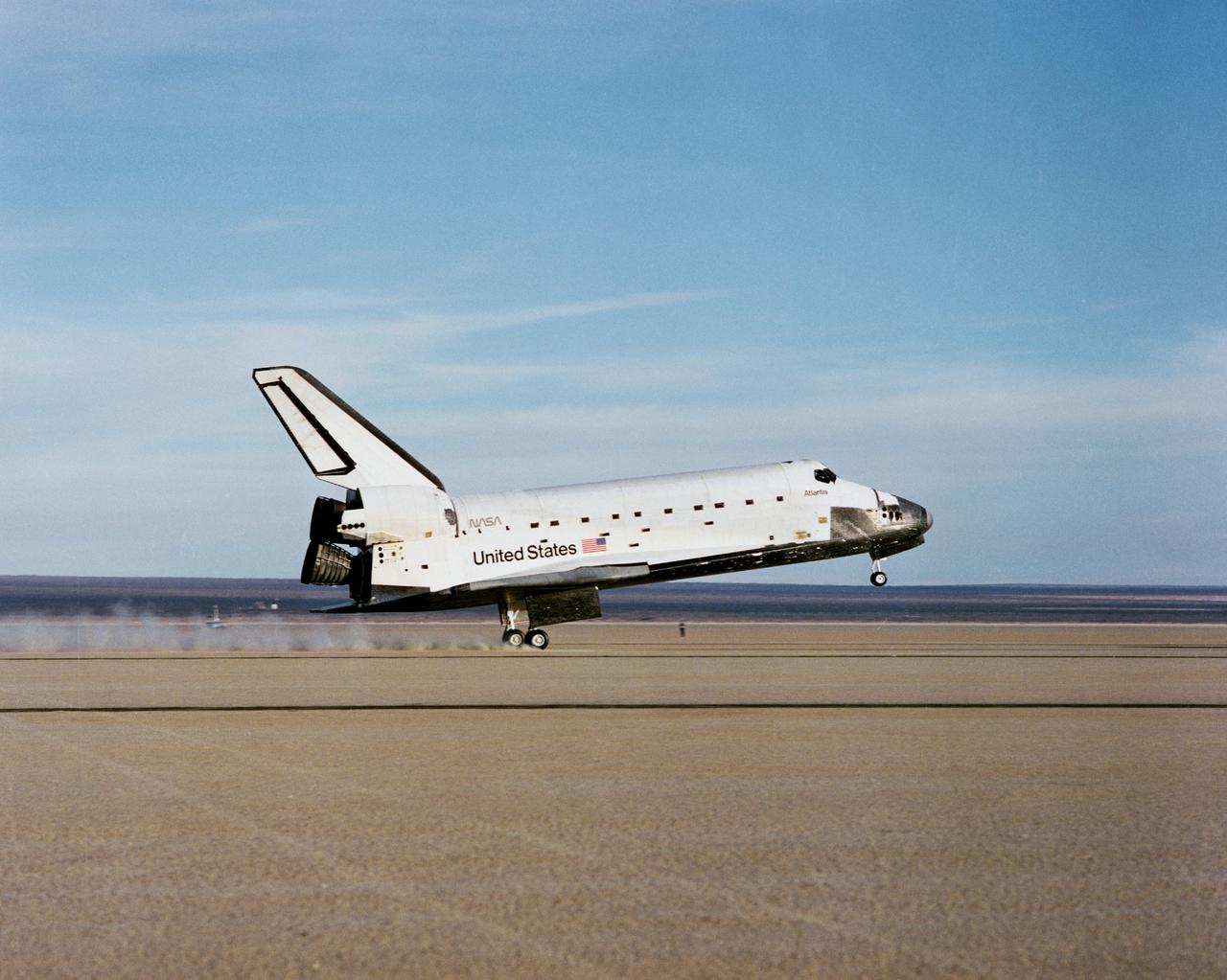 STS027-S-014 (6 Dec. 1988) --- A 70mm camera records the landing of the space shuttle Atlantis on Rogers Dry Lake Bed near the Dryden Flight Research Facility in California. The wheels of the vehicle came to a stop at 3:36:53 p.m. (PST), marking the completion of a successful mission which involved five veteran NASA astronauts. Onboard for the four-day flight were astronauts Robert L. Gibson, Guy S. Gardner, Jerry L. Ross, Richard M. (Mike) Mullane and William M. Shepherd. Photo credit: NASA