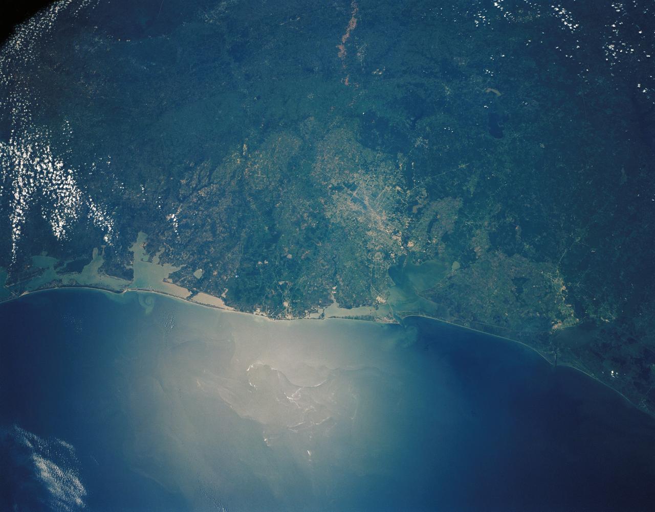 STS030-152-066 (4-8 May 1989) --- The upper Texas and Louisiana Gulf Coast area was clearly represented in this large format frame photographed by the astronaut crew of the Earth-orbiting Space Shuttle Atlantis. The area covered stretches almost 300 miles from Aransas Pass, Texas to Cameron, Louisiana. The sharp detail of both the natural and cultural features noted throughout the scene is especially evident in the Houston area, where highways, major streets, airport runways and even some neighborhood lanes are easily seen. Other major areas seen are Austin, San Antonio and the Golden Triangle. An Aero Linhof camera was used to expose the frame.