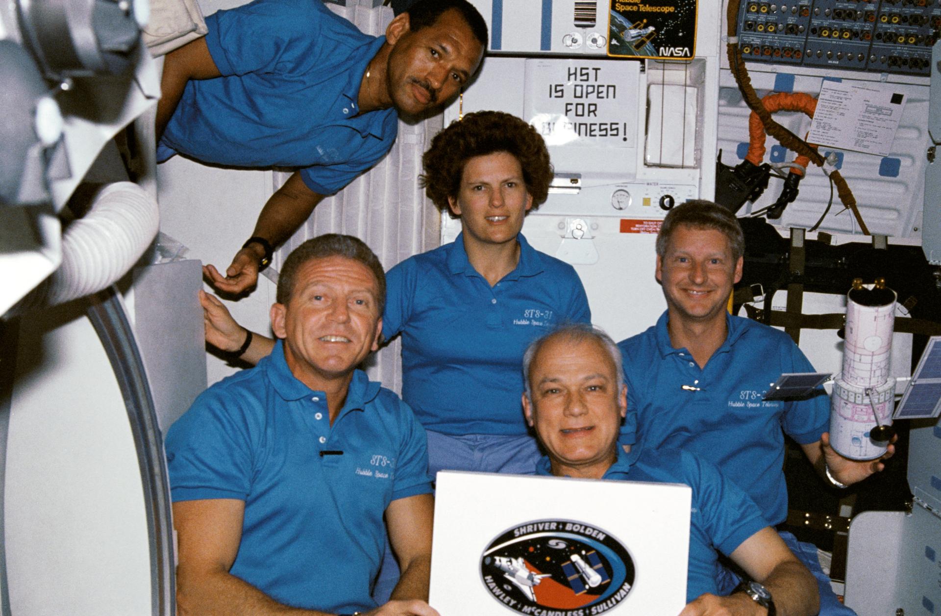 The crew of STS-31 poses for a photo during their mission