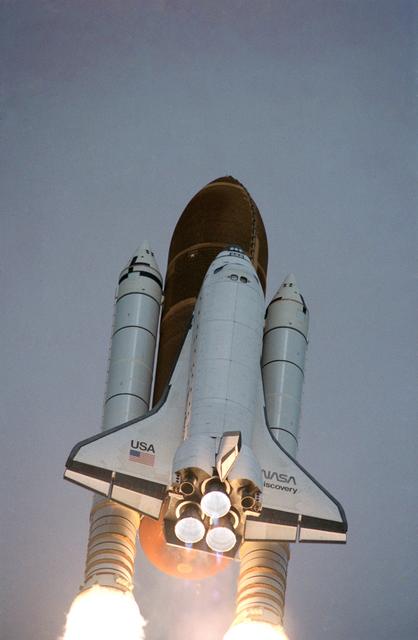NASA image: STS-31 Discovery, OV-103, begins its roll maneuver after liftoff from KSC