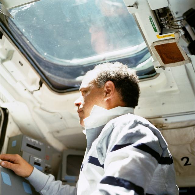 NASA image: STS-33 Commander Gregory looks through window on OV-103's aft flight deck