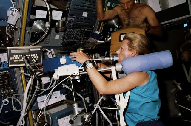NASA image: STS-40 Mission Specialist (MS) Seddon on ergometer conducts Exp. No. 066
