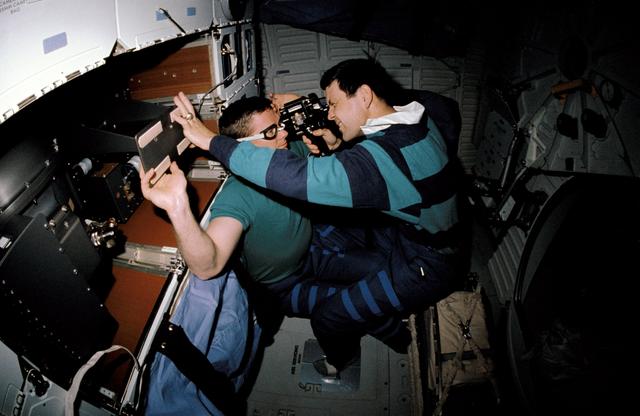 NASA image: STS-41 crewmembers conduct DSO 0474 Retinal Photography on OV-103's middeck