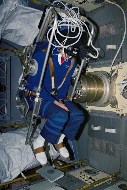 NASA image: STS-42 Mission Specialist (MS) Hilmers in IML-1's MVI rotator chair