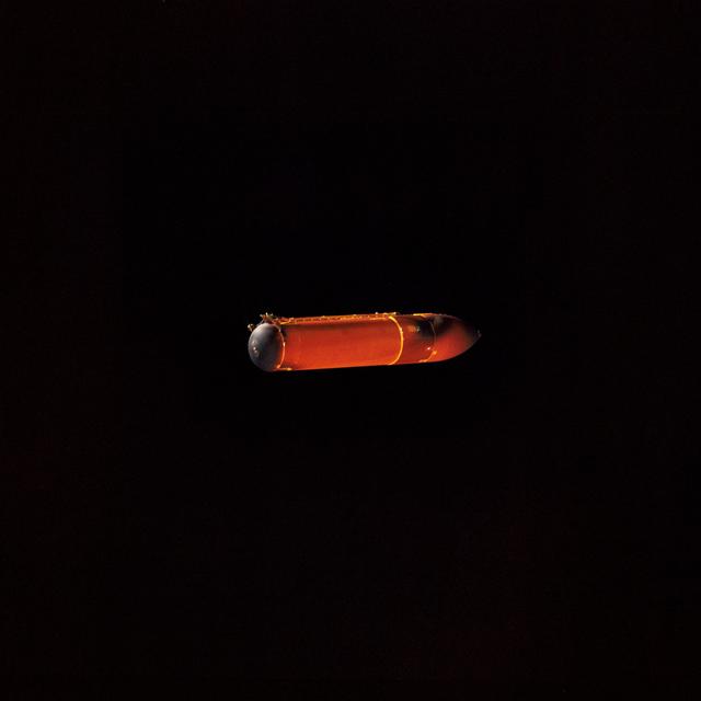 NASA image: STS-45 external tank (ET) falls back to Earth after jettisoning from OV-104