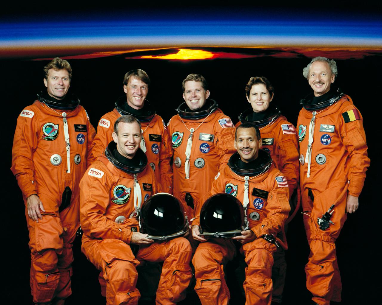 STS045-S-002 (January 1992) --- The seven crew members for NASA's STS-45 mission are pictured in their partial-pressure launch and entry suits. In front are astronauts Charles F. Bolden, Jr. (right), mission commander, and Brian Duffy, pilot. Back row, left to right, are payload specialist Byron K. Lichtenberg; astronauts C. Michael Foale and David C. Leestma, mission specialists; Kathryn D. Sullivan, payload commander; and payload specialist Dirk Frimout, of Belgium. The Atmospheric Laboratory for Applications and Science (ATLAS) is scheduled for a March 1992 launch aboard the Space Shuttle Atlantis.