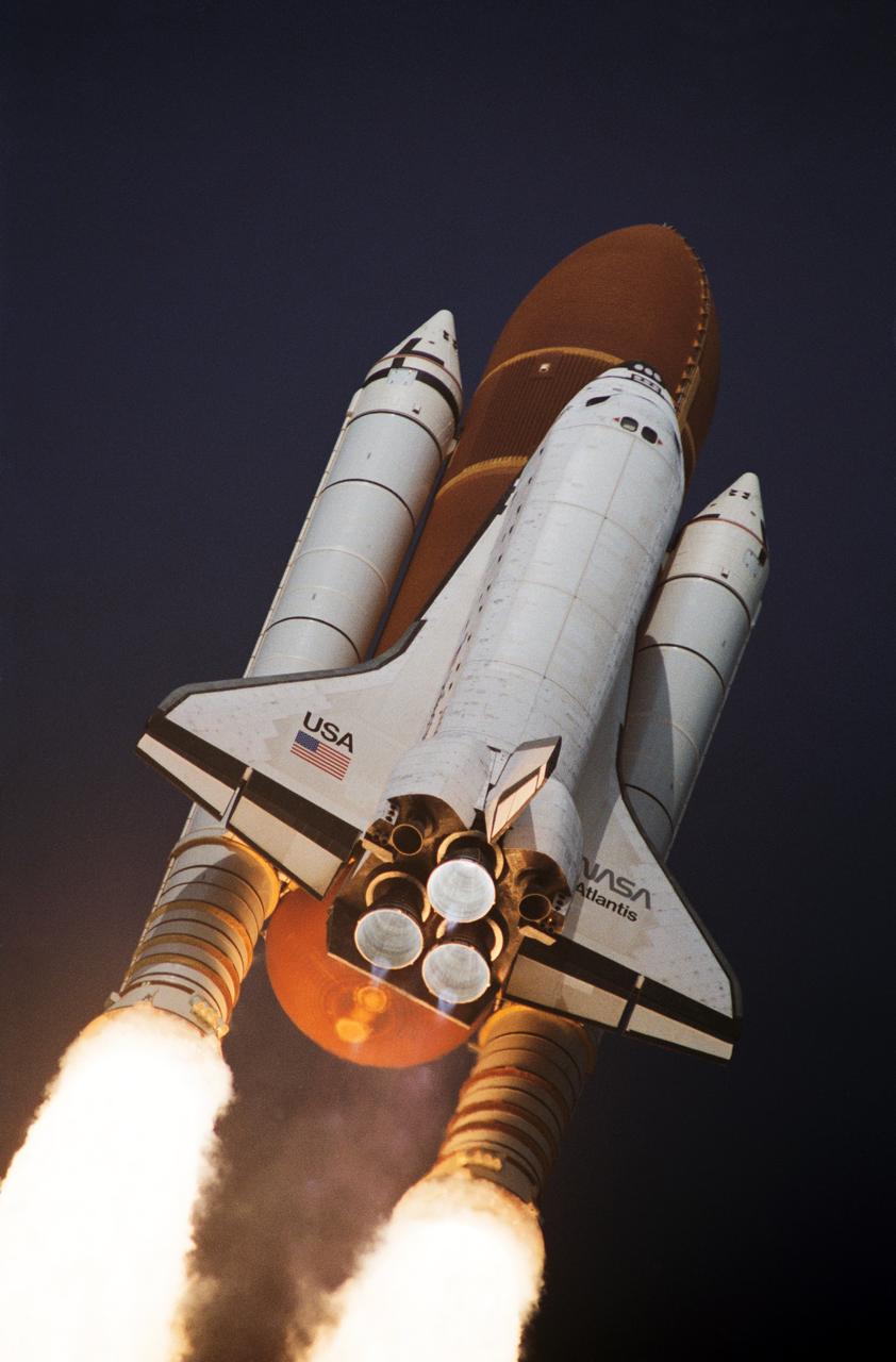 STS045-S-053 (24 March 1992) --- A low-angle view of the Space Shuttle Atlantis as it soars off the launch pad and heads toward Earth orbit with a crew of seven and the Atmospheric Laboratory for Applications and Science (ATLAS) aboard.  Launch occurred at 8:13:40:048 a.m. (EST), March 24, 1992. Onboard were astronauts Charles F. Bolden, STS-45 commander; Brian Duffy, pilot; Kathryn D. Sullivan, payload commander; David C. Leestma and C. Michael Foale, mission specialists; and Dirk Frimout of the European Space Agency and Byron K. Lichtenberg, payload specialists.