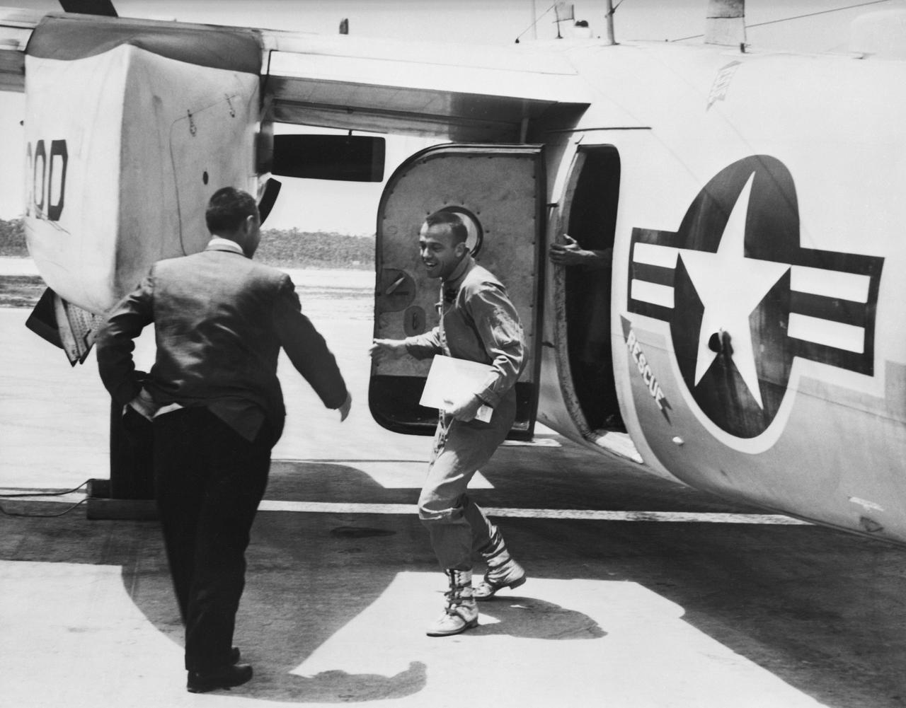 S61-02731 (5 May 1961) --- Astronaut Alan B. Shepard Jr. arrives at Grand Bahamas Island and is greeted by astronaut Virgil I. (Gus) Grissom after the first American suborbital flight. He will participate in a press conference with Grissom and Donald Slayton. Photo credit: NASA or National Aeronautics and Space Administration