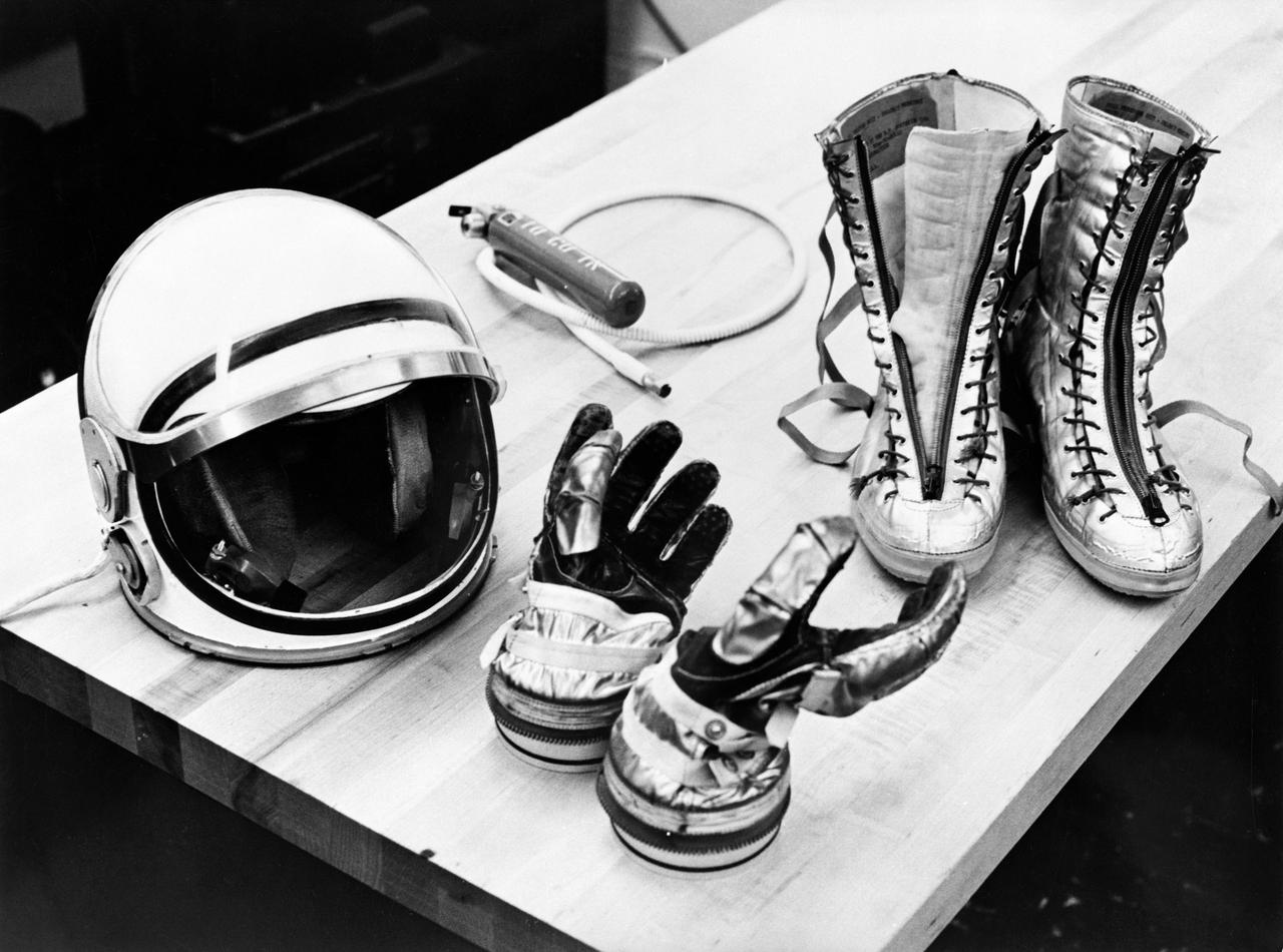 S61-02733 (28 July 1961) --- Table top view of some of the Mercury suit components including gloves, boots and helmet. Photo credit: NASA