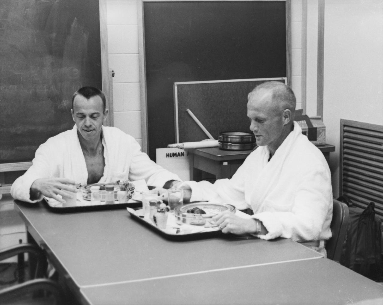 S61-02735 (5 May 1961) --- Astronauts Alan Shepard and John Glenn at breakfast before Shepard's Mercury-Redstone 3 (MR-3) spaceflight. Photo credit: NASA or National Aeronautics and Space Administration