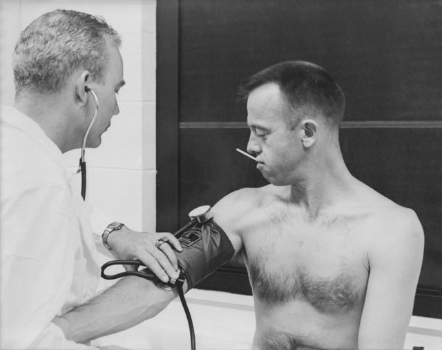 NASA image: Astronaut Alan B. Shepard has his blood pressure and temperature checked