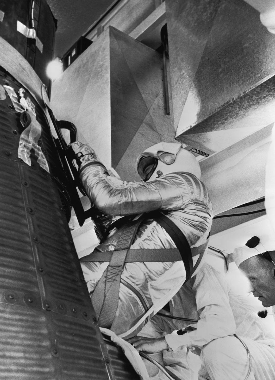 S61-03651 (5 May 1961) --- Astronaut Alan B. Shepard Jr., in his pressure suit and helmet, is being inserted into the Freedom 7 capsule in preparation for the Mercury-Redstone 3 (MR-3) mission. Photo credit: NASA or National Aeronautics and Space Administration