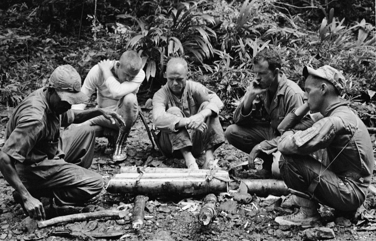 S63-08394 (3-6 June 1963) --- Some of NASA's sixteen astronauts participate in tropic survival training from June 3 through June 6, 1963, at Albrook Air Force Base, Canal Zone. From left to right are unidentified trainer, Neil Armstrong, John H. Glenn Jr., L. Gordon Cooper and Pete Conrad. Photo credit: NASA