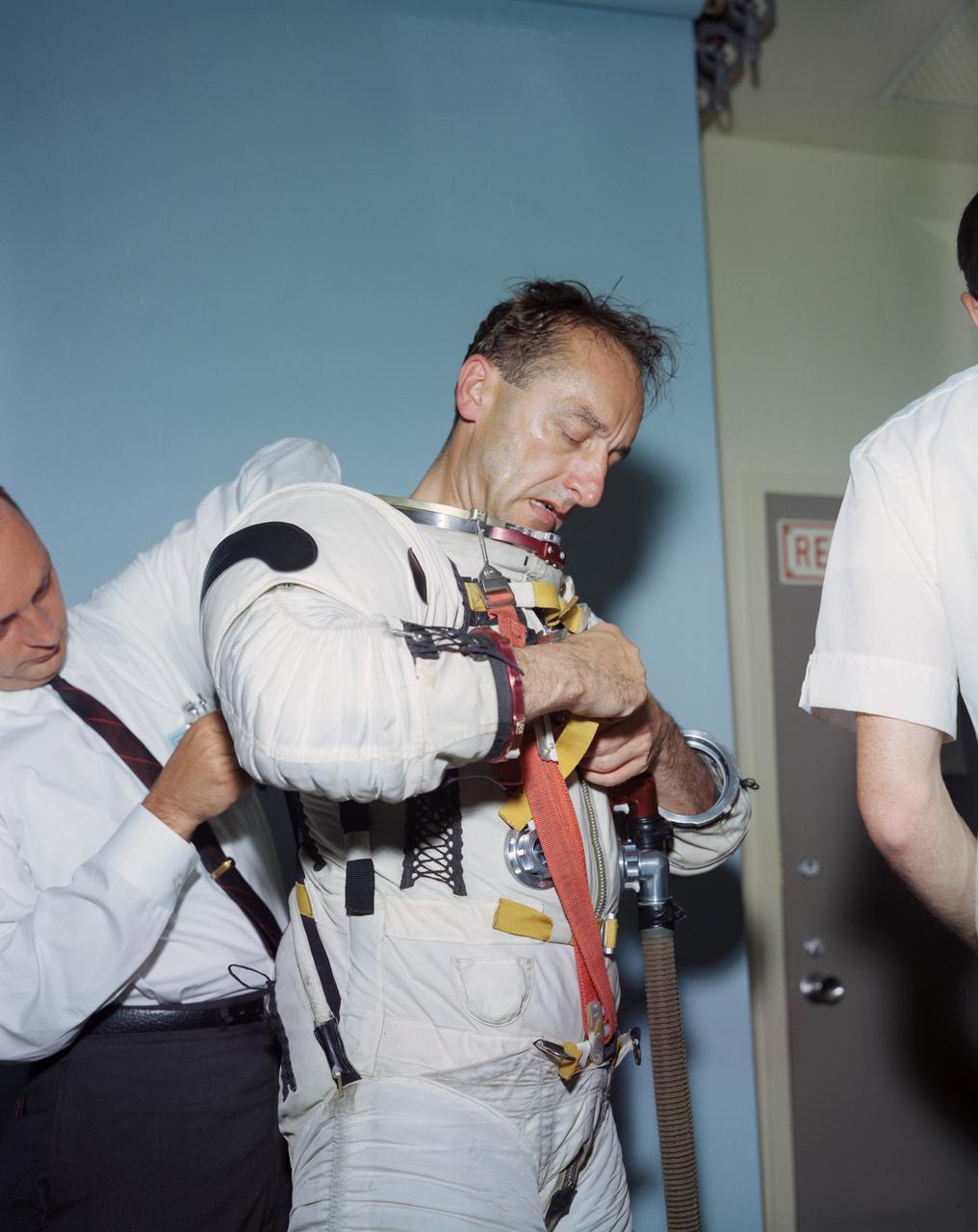 S64-27314 (1964) --- Dr. Mueller & General Funk trying on Apollo & Gemini suits. - Complete Caption Pending