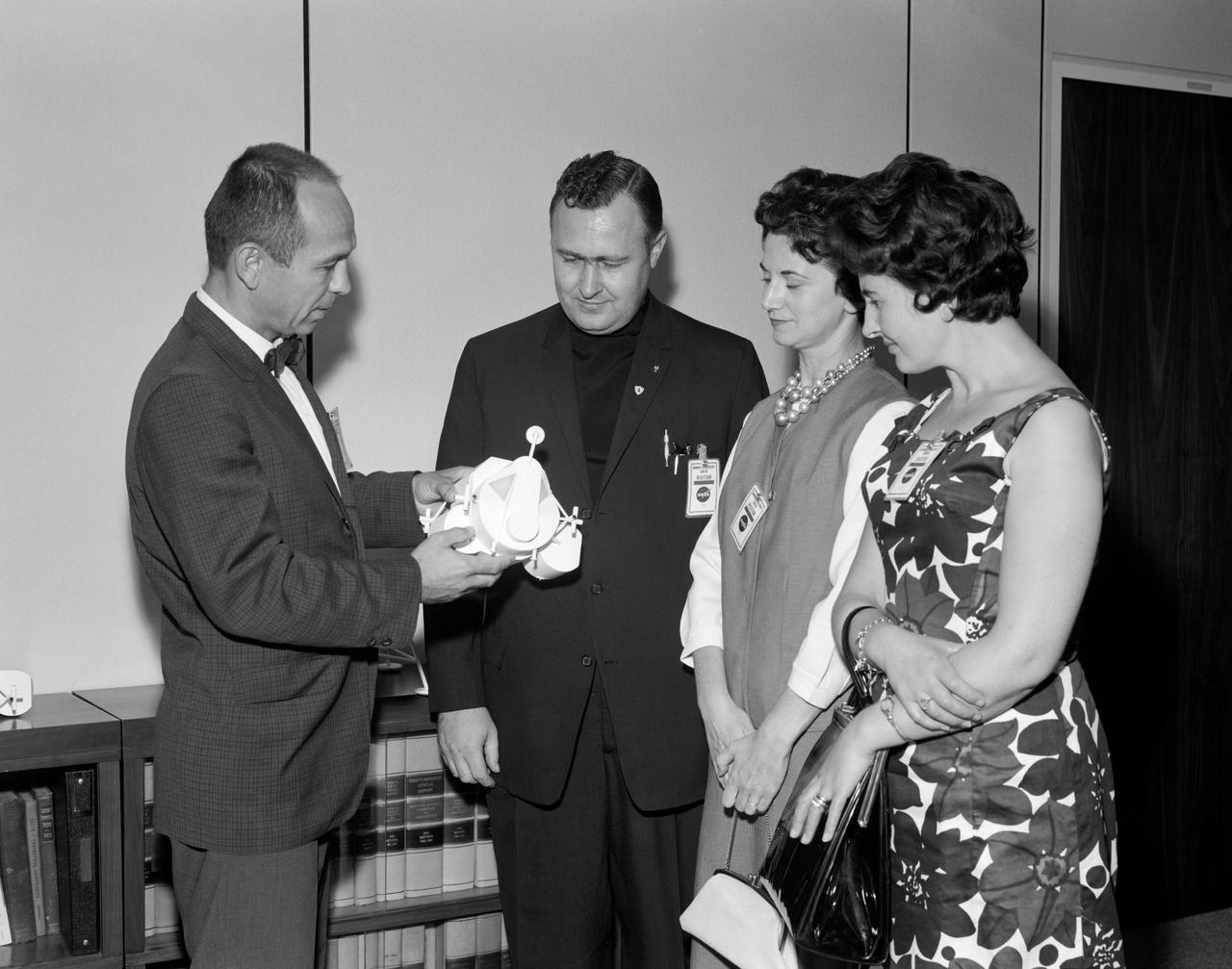 S64-31226 (1964) ---  Maxime A. Faget, Assistant Director for Engineering and Development, at Manned Spacecraft Center, explains the function of the Lunar Module to Father Patrick J. OBrien, sister-in-law to Father O