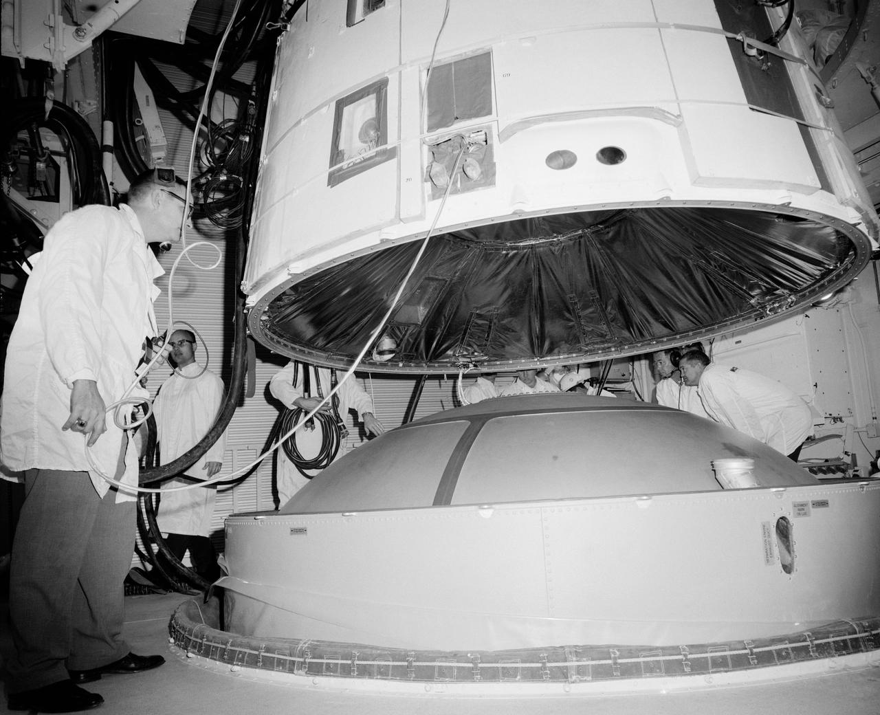 S65-17337 (February 1965) --- Scene in the white room of Pad 19 during the mating of the Gemini Spacecraft 3 with the Titan II launch vehicle.