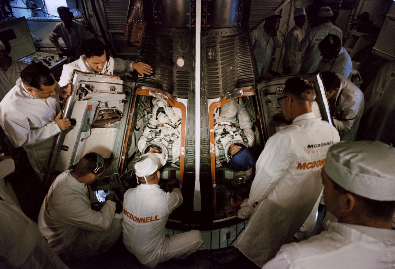S65-29641 (3 June 1965) -- Astronauts Edward H. White II and James A. McDivitt are shown in the white room as they enter the Gemini-4 spacecraft atop the Titan launch vehicle at Cape Kennedy, Florida. The NASA Headquarters alternative photo number is 65-H-291.