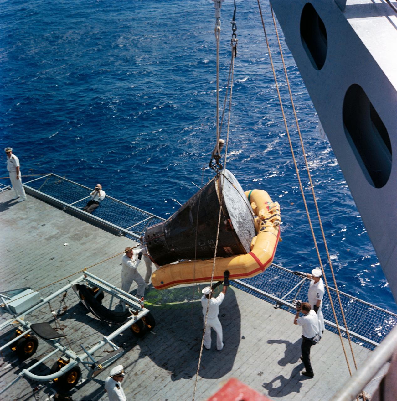 S65-32962 (7 June 1965) --- The Gemini-4 (GT-4) spacecraft is hoisted aboard the recovery ship USS Wasp during recovery operations following the successful four-day mission.