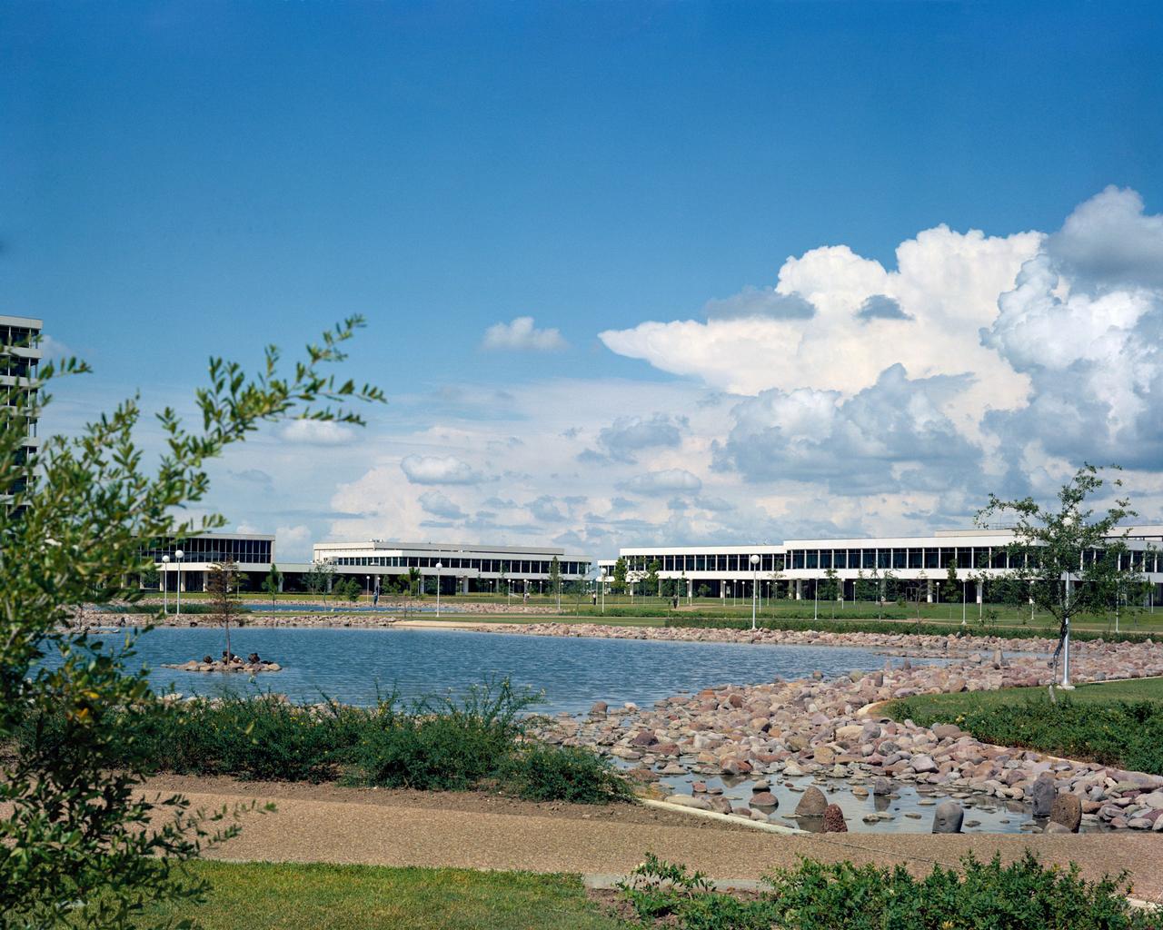 S65-41769 (1965) --- View of facilities at the Manned Spacecraft Center, Houston, Texas. Photo is taken from across the fish pond.     NOTE: The Manned Spacecraft Center was named Lyndon B. Johnson Space Center in memory of the late President following his death.