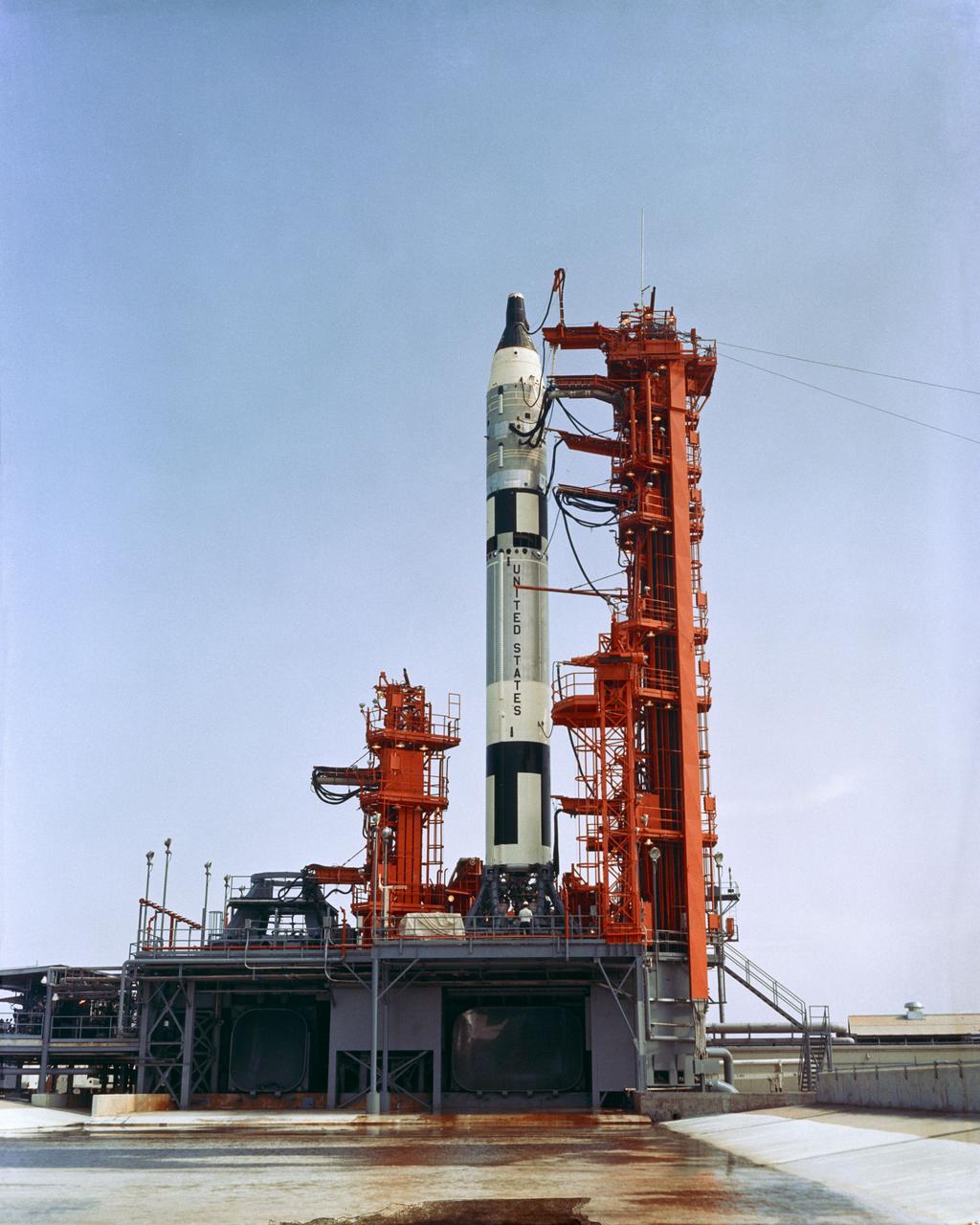 S65-43447 (22 July 1965) --- Overall view of Pad 19 showing Gemini-5 spacecraft atop the Gemini Launch Vehicle 5 during a wet mock simulation exercise.