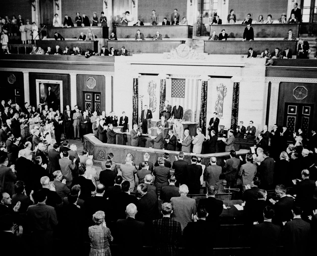 S65-44234 (14 Sept. 1965) --- The Gemini-5 crew, astronauts L. Gordon Cooper Jr., command pilot, and Charles Conrad Jr., pilot, receive a standing ovation during their visit to the U.S. House of Representatives on Sept. 14, 1965, after their record setting eight-day mission in space.